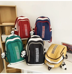 Collection of color-block nylon backpacks in five colors with cute panda plush pendants