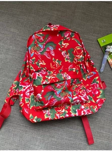 Close-up of durable canvas backpack featuring traditional Chinese floral peony patterns
