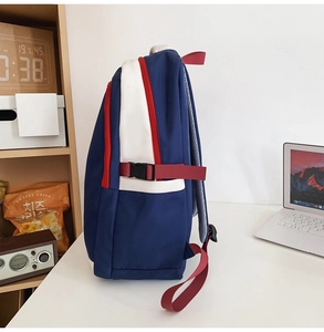 Detail of color-block nylon backpack with multi-layer zippers and side breathable mesh