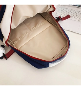 Detail view of the spacious inner compartment and interior pockets of the contrast backpack