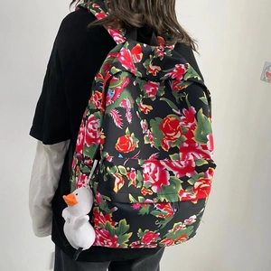 Ethnic style backpack with vintage red floral pattern and white duck plush charm