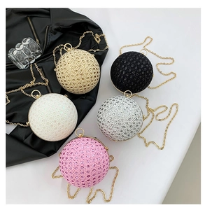 Detailed collection of five luxury spherical evening clutch bags with sparkling finishes