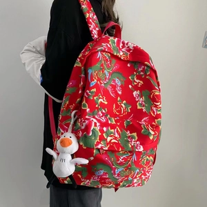 Ethnic style floral backpack with dragon patterns and a cute duck plush keychain accessory