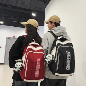 Large contrast nylon backpack in red and black with panda pendant for students