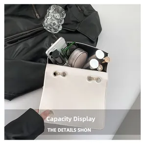 Internal view of beige quilted bag showing storage for phone, makeup, and sunglasses