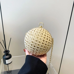 Sparkly spherical evening bag with gold rhinestones and elegant metal chain strap