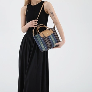Bohemian woven tote bag with geometric stripes, brown leather handles and shoulder strap