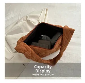 Detail view of spacious quilted corduroy tote bag showing large capacity for essentials