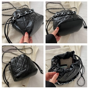 Detailed views of a black quilted bucket bag with silver chain handles and drawstring closure