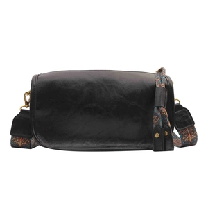 Sac bandoulière minimaliste en similicuir noir avec bandoulière tissée style ethnique
