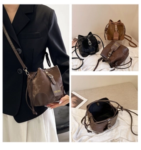 Three-color contrast vintage crossbody bucket bags showing interior capacity and strap detail