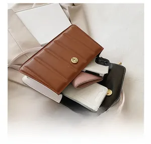 Detail view of spacious interior storage in a retro color-block crossbody square bag