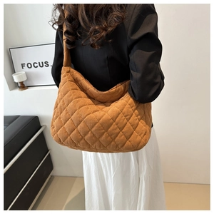 Brown corduroy hobo bag featuring quilted diamond pattern on soft oversized shoulder tote