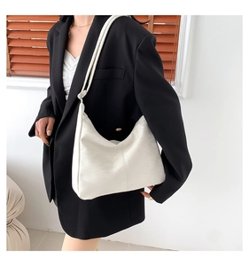 Detail of high-quality white PU leather texture on minimalist large capacity tote bag
