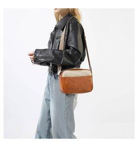 Detail of color-block crossbody bag with quilted PU leather and patterned wide strap