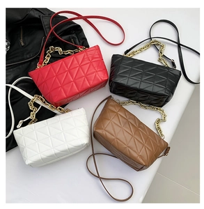 Quilted crossbody bags in red, black, white, and brown with gold chain strap detail