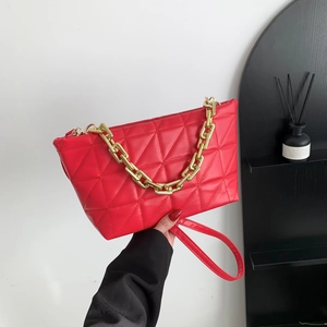 Quilted red crossbody bag with a chunky gold chain handle and vintage design for women