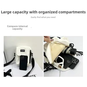 Detailed interior capacity showing space for phone, umbrella, and sunglasses in white canvas bag