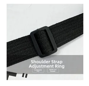 Close-up of adjustable plastic buckle and durable black nylon webbing on the shoulder strap