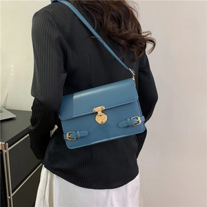 Morandi blue crossbody bag with gold round lock and vintage British style for women