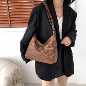 Brown hobo shoulder bag with pleated texture and stylish large capacity design