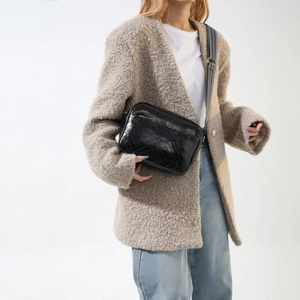 Chic black quilted crossbody bag with wide strap for casual spring 2024 women's fashion