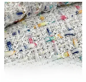 Macro shot of colorful tweed fabric detail showing premium multi-color woven texture