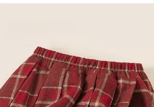 Close-up of elastic waistband on classic red and beige checkered winter plaid skirt