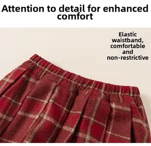 Detail of red plaid wool skirt showing the comfortable elastic waistband for girls