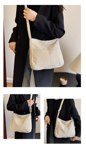Detail of beige corduroy tote bag showing front pockets and adjustable shoulder strap
