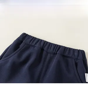 Detail of high-elasticity ribbed waistband on girls navy blue knit leisure pants