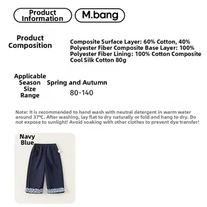 Detail of navy blue toddler trousers showing ruffled lace cuffs and cotton blend fabric