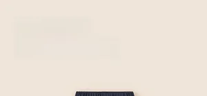 Detailed close-up of navy blue toddler girl pants with elastic waist and ruffle edge