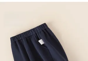 Detail of baby winter casual pants with elastic waistband and side pocket in dark blue