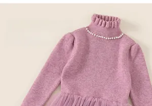 Detail of girls lilac knitted dress with pearl collar and layered mesh tulle skirt
