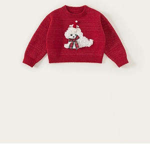 Detailed view of red knitted children's sweater with festive poodle applique and ribbed cuffs