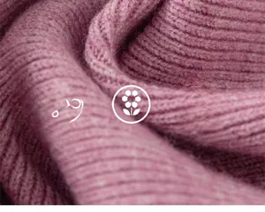 Close-up of soft lavender knitted fabric with premium ribbed texture and fuzzy mohair feel