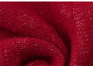 Macro shot of soft red knitted wool fabric texture for girls warm autumn winter sweaters