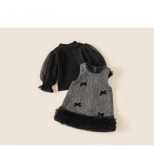Detail view of girls' winter tweed dress set with mesh bubble sleeves and velvet bows