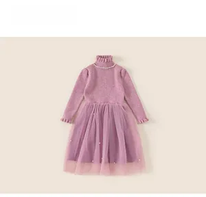 Detail of girls knit dress with pearl collar and layered tulle skirt in pink