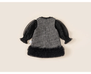 Close-up of girls tweed dress back with sheer mesh sleeves and ruffled lace hem detail