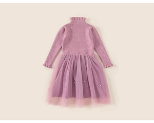 Detail of pink knit bodice with ruffled neck and pearls on layered mesh tutu skirt