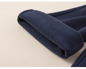Close-up of thick navy fleece lining for kids' warm trousers showing soft thermal texture