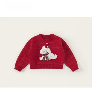 Detail of red knit sweater with festive teddy bear embroidery and plaid bow decoration