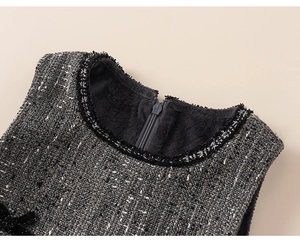 Close-up of girls' tweed dress neckline with fleece lining and zipper detail
