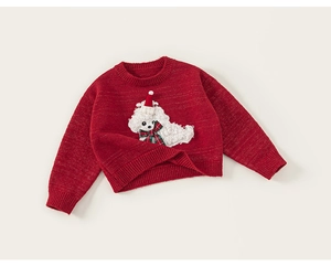 Detail of red knit kids sweater featuring a 3D plush puppy patch in Christmas outfit