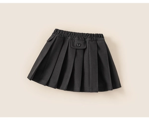 Detail view of girls' black pleated skirt with button flap pocket and elastic waistband