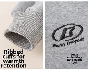 Detail of grey knitted sweatshirt featuring ribbed cuffs and B Energy Everyday embroidery