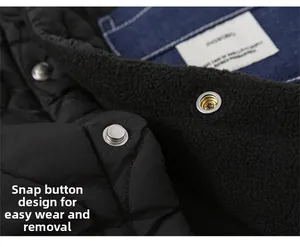 Detail of child's padded jacket featuring snap button closure and warm fleece lining
