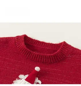 Detail of red knit sweater with ribbed neckline and festive 3D applique embroidery